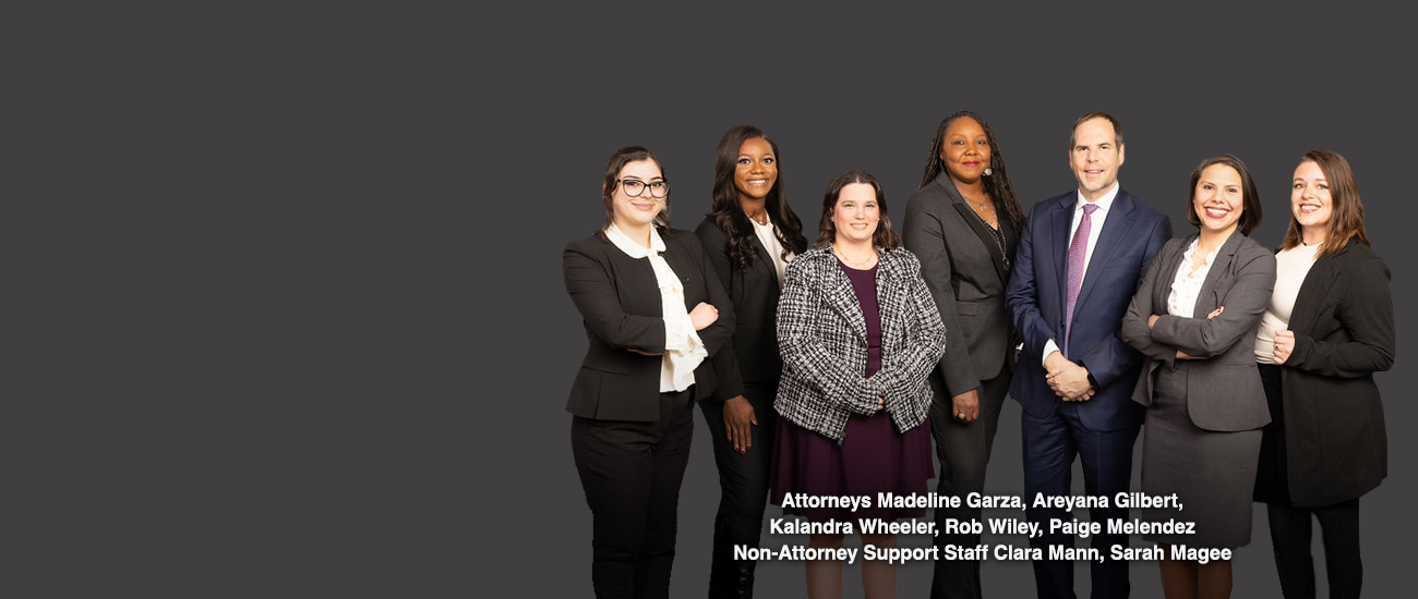 Group picture of Attorneys Madeline Garza, Areyana Johnson, Kalandra Wheeler, Rob Wiley, Paige Melendez, Non-Attorney Support Staff Clara Mann, Sarah Magee